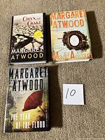 Front covers of the three hardcover novels