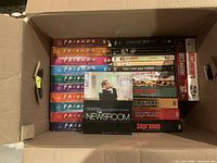Top view of box showing Friends seasons, Planet Earth, The Newsroom and Sopranos sets