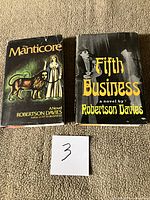 Front dust jackets of both novels side by side