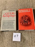 Front view of both books showing dust jackets and titles