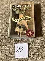 Front of The Robber Bride dust-jacketed hardcover with lot marker