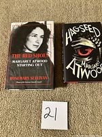 Front covers of both hardcover books with dust jackets visible