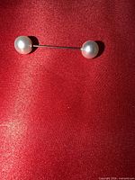 Front view of brooch showing both faux pearl ends attached