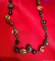 Detail of lower section showing variety of beads