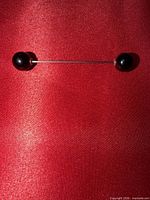 Full view of brooch assembled showing length and bead finials