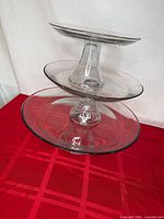 Angled view showing all three glass tiers and pedestals