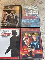 Four DVD cases front covers visible