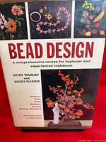 Front cover of Bead Design book showing title, authors, and beadwork images