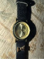 Front view of Attention watch showing dial and strap