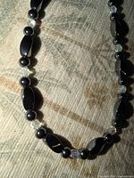 Close-up of bead pattern showing black stone and clear crystal beads