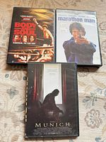 Three DVD cases: Body and Soul, Marathon Man, Munich