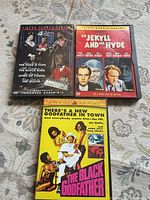 All three DVD cases laid out: Silver Screen Series, Dr. Jekyll and Mr. Hyde, The Black Godfather