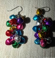 Front view of both earrings showing multicolor jingle bell clusters