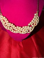 Front view of faux pearl choker on display form