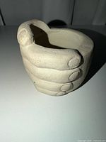 front side view of ceramic hand dish showing finger detailing
