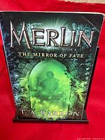 Front cover showing title, author, series and artwork