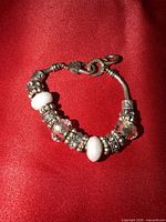 Full view of charm bracelet showing all beads and clasp