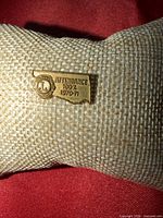 Front view showing design, emblem and text