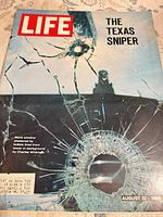 Front cover showing title, bullet-shattered glass image, headline "THE TEXAS SNIPER"