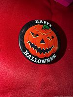 Front view showing pumpkin graphic and Happy Halloween text