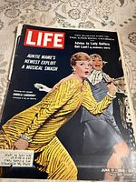 Front cover showing title, date, Auntie Mame headline and image