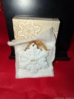 Ornament on felt with original box