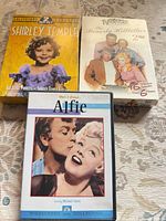 Group shot of three DVD sets: Shirley Temple, Beverly Hillbillies, Alfie