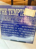 Front of sealed The Temptations Greatest Hits LP showing full cover and price sticker