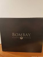 Outer branded retail box showing Bombay logo