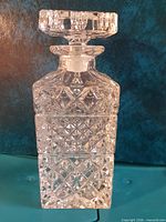 front view of crystal decanter with stopper attached