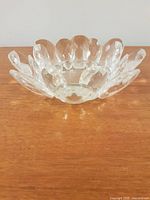 Side view of faceted crystal flower-shaped candle holder