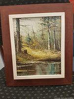Full view of framed abstract landscape painting