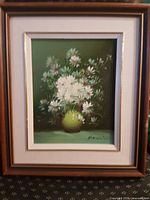 Full view of framed painting showing artwork and frame style