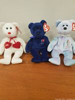 White Love bear, dark blue Signature bear, pastel tie-dye 2001 Holiday Teddy