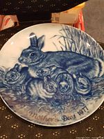 Front view showing rabbit motif and inscription