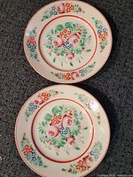 Both matching Hollóháza plates front view showing full pattern