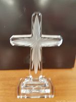 Front view of clear lead crystal cross with starburst cut pattern