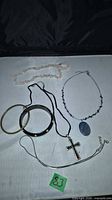 All seven jewelry pieces laid out together
