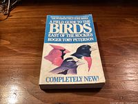 Front cover showing title, author, series, bird illustrations