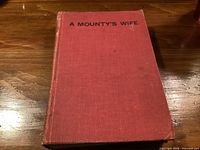 Front cover showing red cloth boards and title