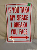 Front of sign showing full text and arrow