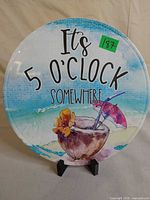 Front of round sign with text and graphic