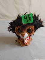 Front view of Ramsey plush with tag and horn visible
