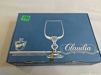 Front of Belfor Claudia box showing glass illustration and branding