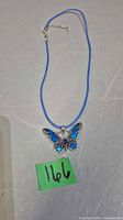 Full view of necklace with pendant and cord