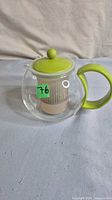 Side view of teapot assembled with lid and infuser