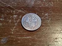 Reverse side of 1971 Canadian dollar coin with British Columbia coat of arms