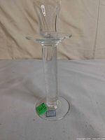 Full view of clear bubbled glass candle holder standing upright