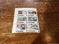 Front view showing six 8¢ Canada stamps in block with margin