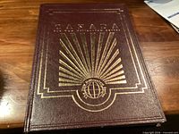 Front cover showing title and gold sunburst design